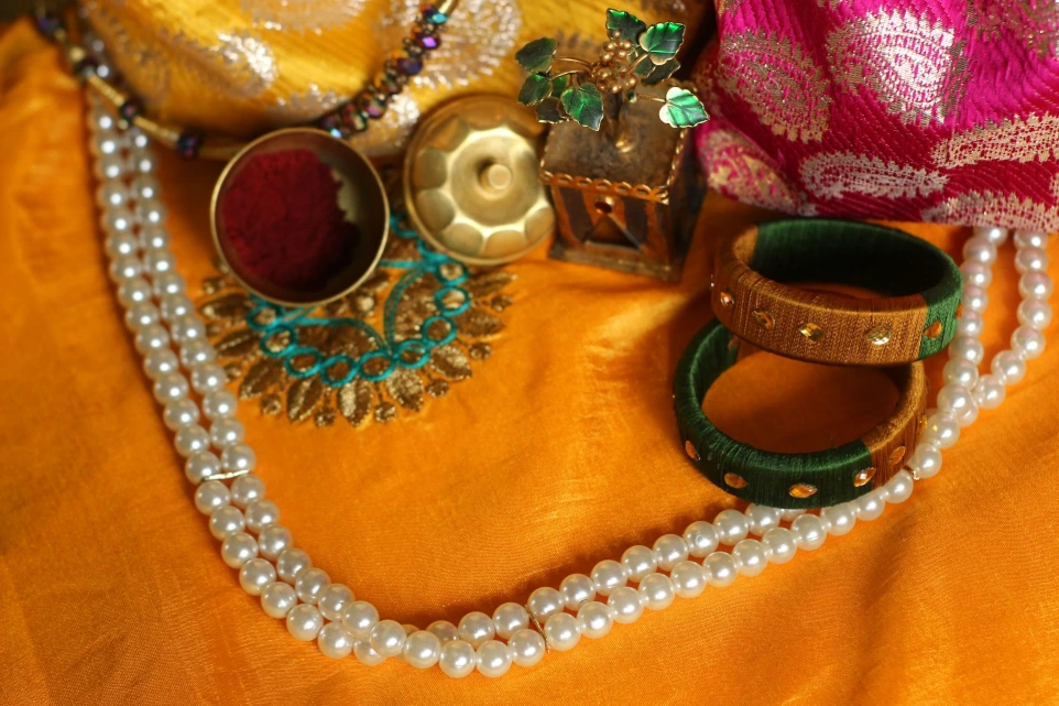a close up of a necklace on a table