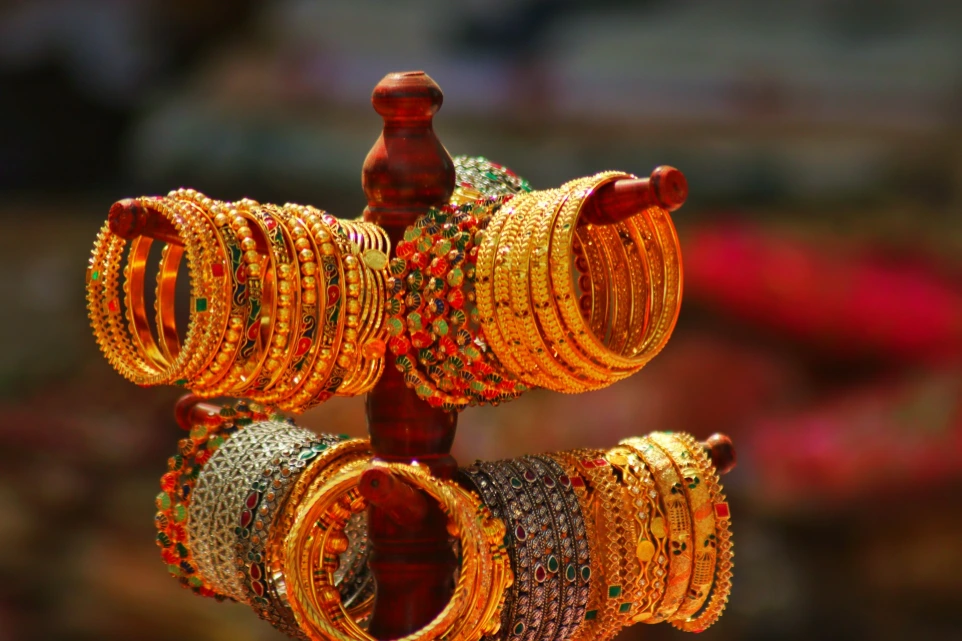 a bunch of bracelets that are on a stand