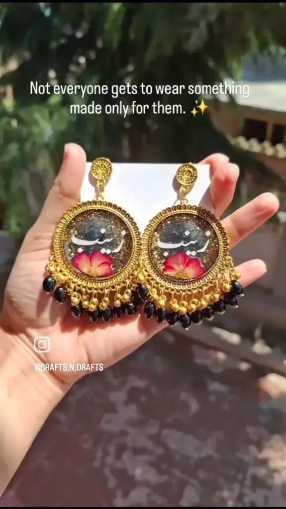 Urdu calligraphic glitter resin earring.