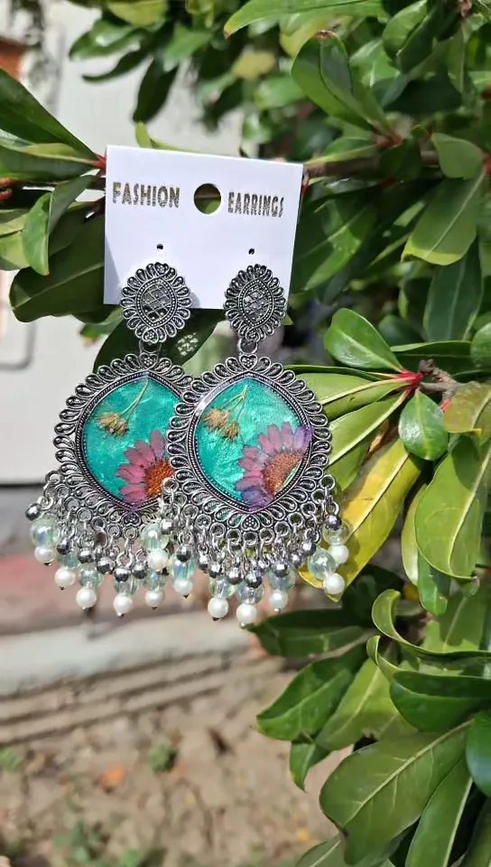 Cyan resin with silver framed earring.