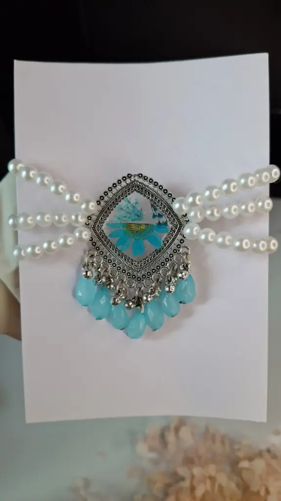 Blue ocean resin pendant.